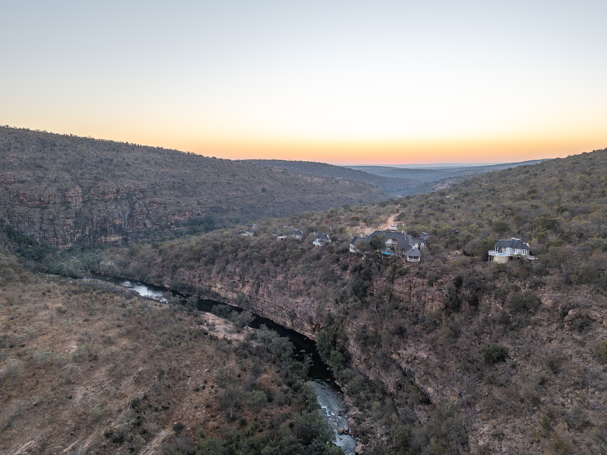 Clifftop Exclusive Safari Hideaway lodge aerial with sunset