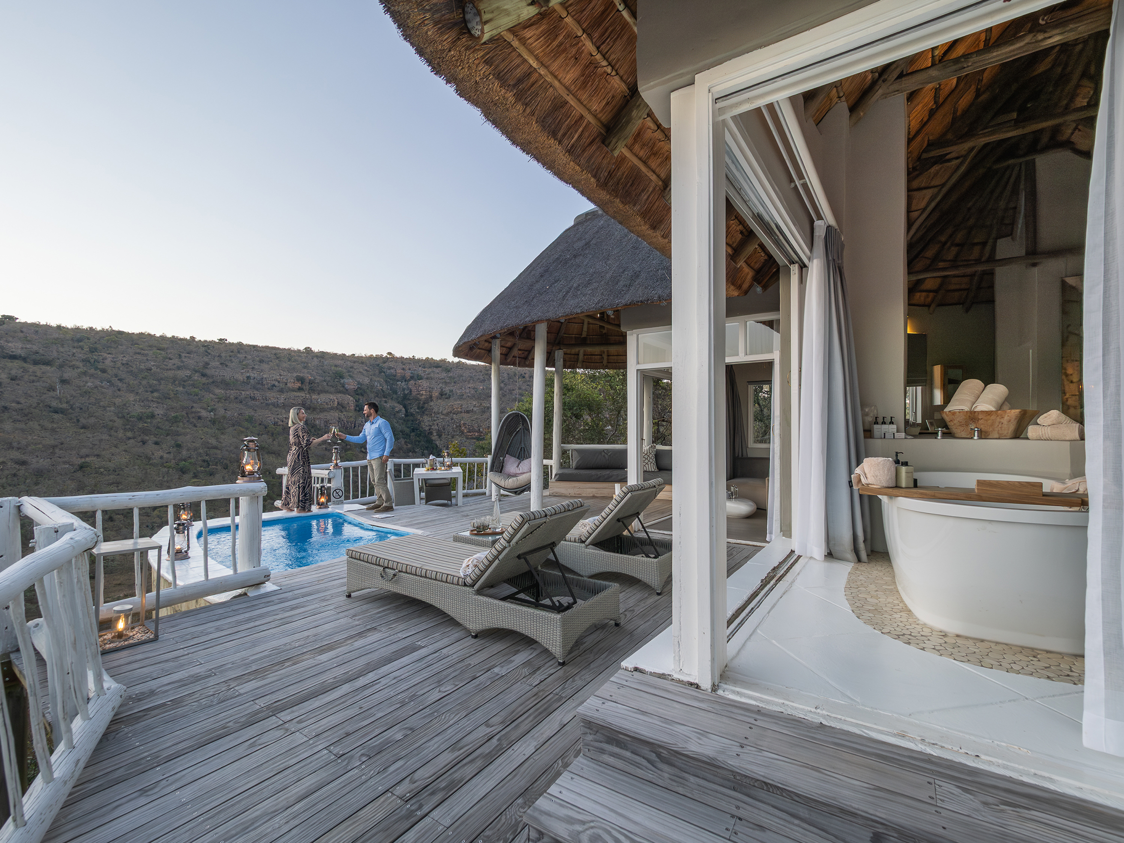 Clifftop Exclusive Safari Hideaway suite with guests on deck